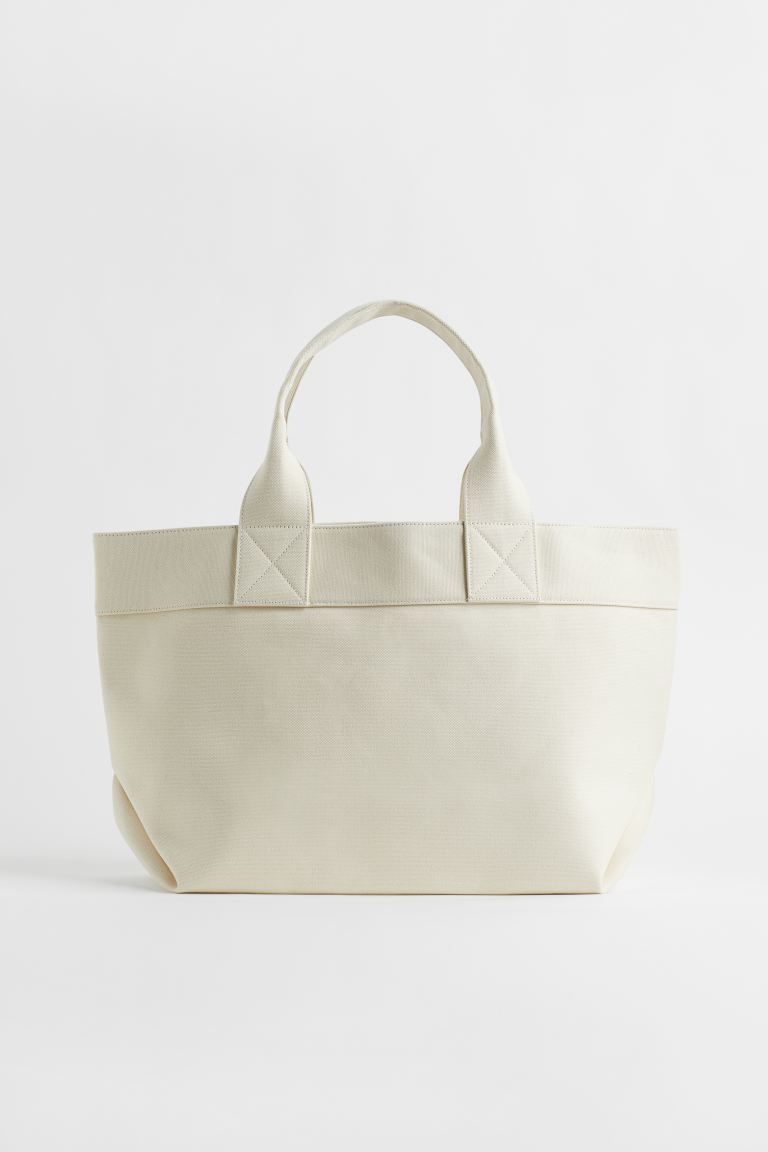 Shopper in thick cotton canvas. Two handles at top and an inner compartment with zipper. Lined. | H&M (US + CA)
