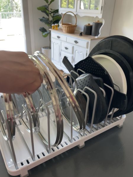 New cabinets organization. I was so tired of lids all over the place, falling out when we tried to get something else out of the cabinets. This non slip adjustable organizer is perfect! 

#LTKhome #LTKunder50 #LTKFind