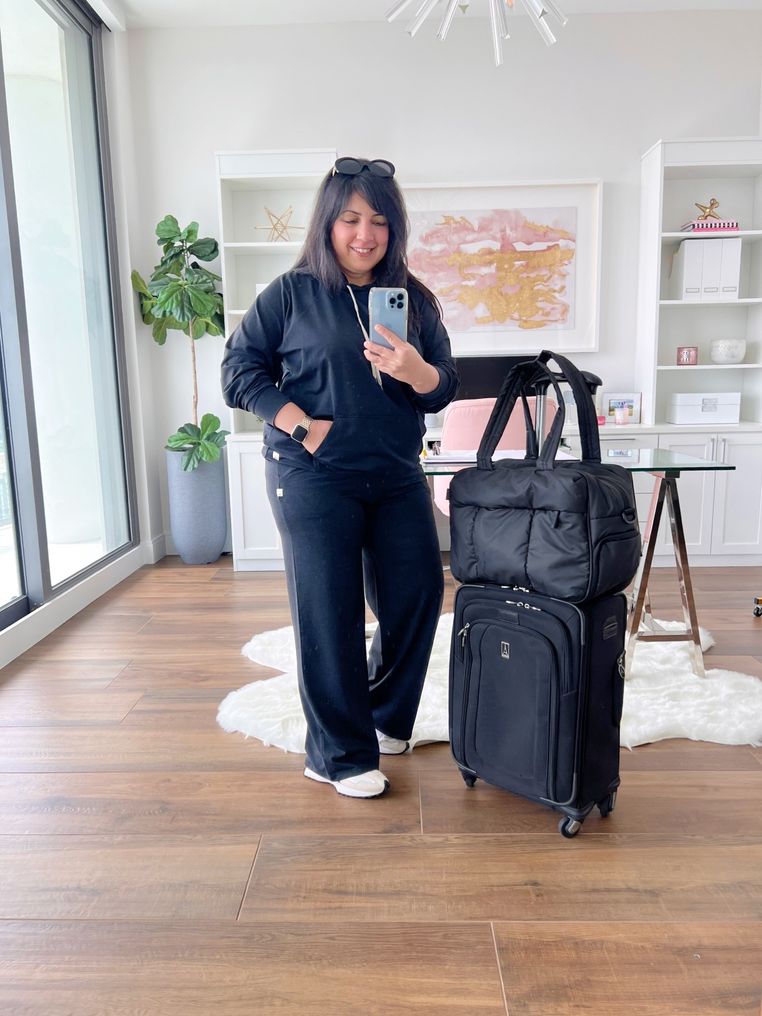 Travel outfit! Vuori Halo oversized hoodie and Halo Essential Wide Leg pants size large. The material is so unbelievably soft and comfortable and it’s very lightweight so it’s not too hot for the Warner months. New Balance 327 sneakers true to size. Celine sunglasses. CALPAK Luka duffel bag. Travelpro carryon suitcase.

#LTKTravel #LTKFallSale #LTKActive