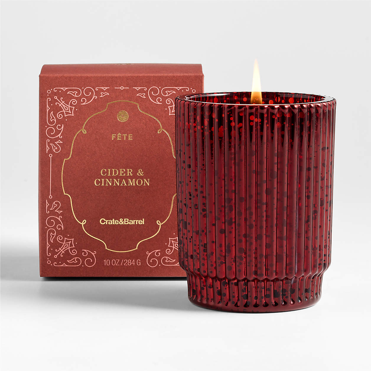 Fete Red Orange Cinnamon Holiday 1-Wick Scented Candle | Crate & Barrel | Crate & Barrel