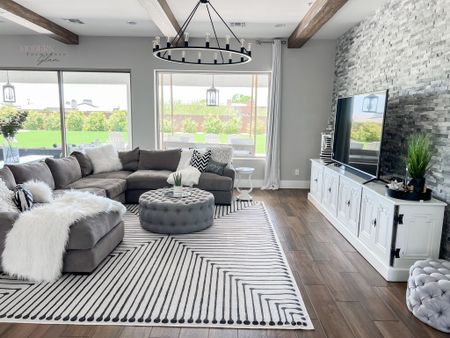 Greatroom sofa sectional rug tufted ottoman media console wood beams at Modern Farmhouse Glam 

#LTKhome