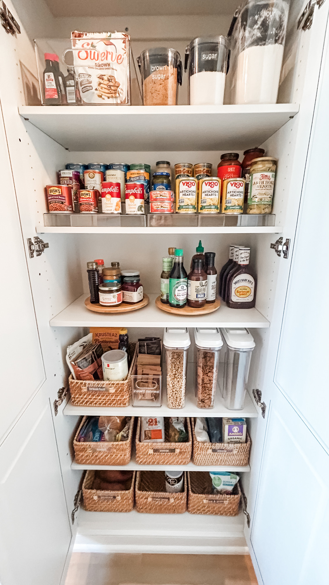 There's just something so satisfying about an organized pantry. These clear containers, turntables, risers, and rattan baskets make it easy to look at AND easy to use. Plus it always makes us so happy when baskets fit perfectly on a shelf (though, yes, we planned it that way!). 

 