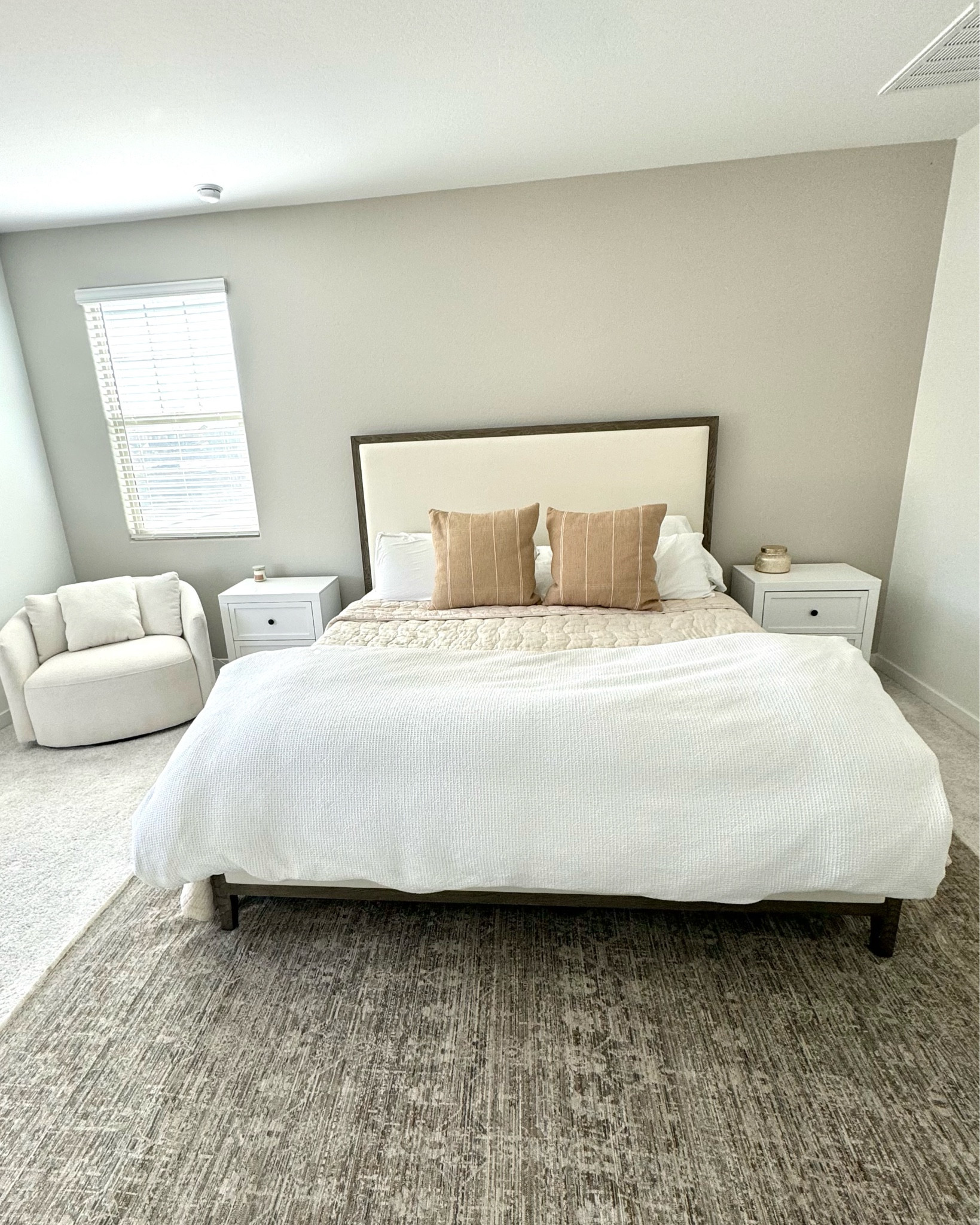 I just got a new bed frame for our bedroom and I love the wood/upholstery combo. This boucle chair is super affordable and very comfortable 