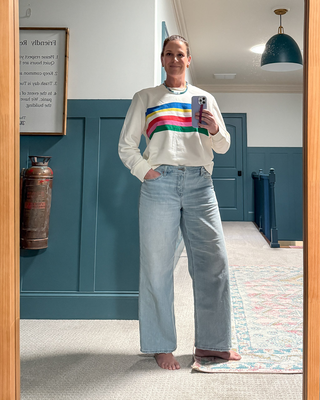 I've been wearing this rainbow-striped sweatshirt on repeat. It's true to size. The jeans have been a favorite of mine for a while now. They are also TTS. If you are between sizes, I would go up in the jeans.  

 #LTKOver40 #LTKMidsize