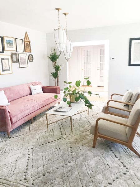 This gorgeous living room got a serious style upgrade with an Anthropologie couch, west elm coffee table, and mid century chairs.  #livingroom #livingroomdecor #couch #rug #coffeetable

#LTKhome #LTKsalealert #LTKunder100