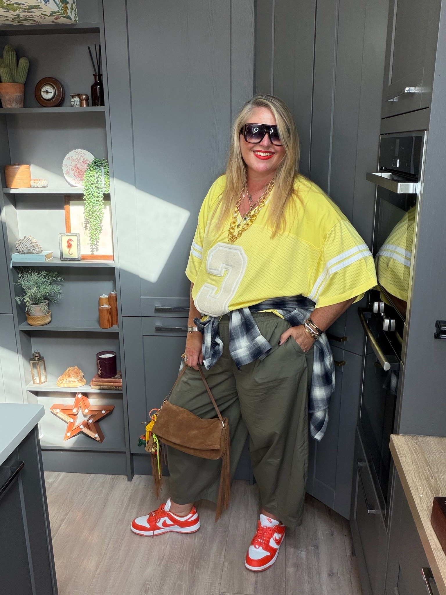 Khaki barrel leg trousers, yellow top, orange trainers, brown suede bag, sunglasses, check shirt, earrings

#LTKautumn #LTKplussize #LTKstyletip