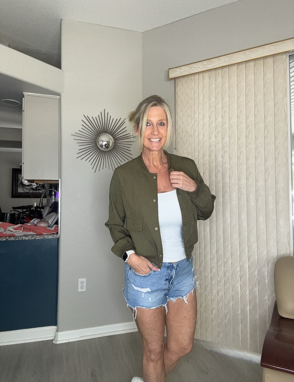 This army green bomber jacket is the perfect lightweight layer for those in-between seasons. Paired with a simple tank and distressed denim shorts, it’s an easy, everyday outfit that looks put together without trying too hard. The relaxed fit makes it comfortable, while the structured style keeps it flattering.

Perfect for running errands, casual days out, or when you just want a go-to outfit that works every time.

#LTKOver40 #LTKootd #LTKMidsize
