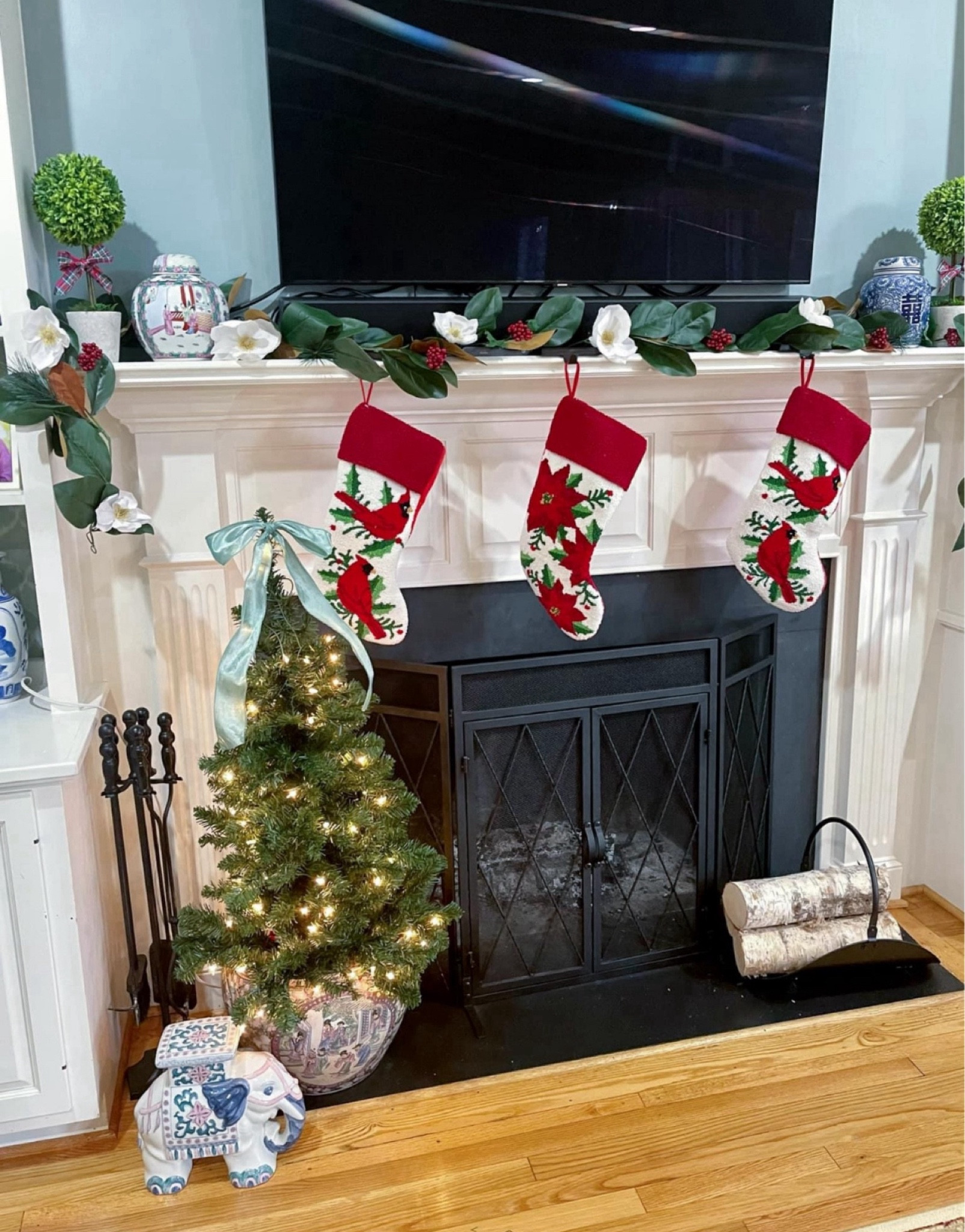 Grandmillennial Christmas decor, Christmas stockings, topiary c mantle decor, garland 

#LTKHome #LTKFindsUnder50 #LTKHoliday
