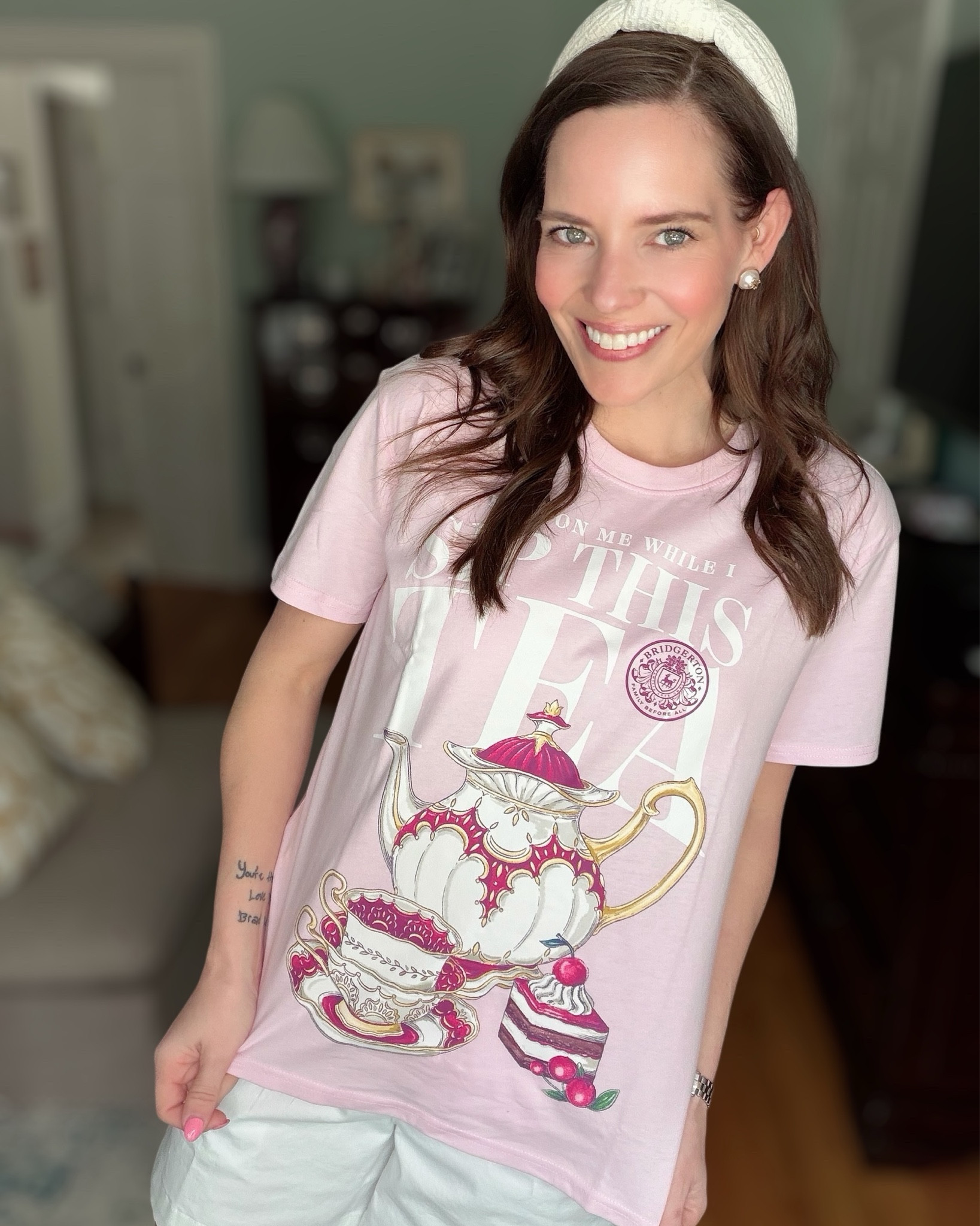 Bridgerton Tea Graphic Tee Outfit 🫖💗 Casual Spring Look

Such a fun find for any Bridgerton fan! This pink graphic tea tee is just $8 and makes the cutest casual spring or summer outfit. I paired it with classic white shorts, pearl studs, a feminine headband, and my favorite white sneakers for an easy everyday look that still feels polished and preppy. Perfect for errands, coffee runs, or a relaxed weekend outfit.

I sized way up to a Medium in the tee for a relaxed, slightly oversized fit and paired it with simple white shorts.

bridgerton graphic tee, pink graphic tee outfit, casual spring outfit, white shorts outfit, preppy casual style, feminine casual look, affordable walmart fashion, summer casual outfit, pink tee outfit, everyday sneakers outfit 💗✨

#LTKPetite #LTKOver40 #LTKootd