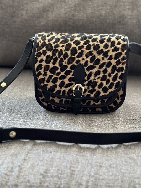 Loving the leopard calf hair Romeo bag from Sezane. It is a messenger style with a faux buckle clasp. Add this to your wish list! Other bags featured are the Claude and Milo bags also from Sezane. 

#LTKitbag #LTKGiftGuide #LTKstyletip