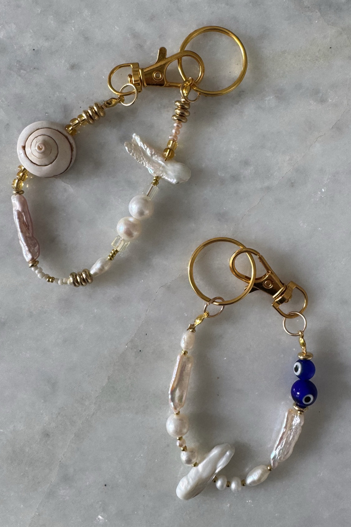 Bag Charms ✨ I’m loving these fun bag charms that I found on Etsy. The evil eye and pearl is dj. For everyday and I picked up the pearl and shell for vacation, travel and summer. Both are neutral enough to pair with any bag, tote or crossbody and add a fun touch. 

Bag charms, purse charm, bag charm, charm accessory, pearls, shell, evil eye, spirit eye, travel bag, work bag, purse, target finds, Anthropologie, Etsy, target style, target 

#LTKItBag #LTKFindsUnder50 #LTKStyleTip