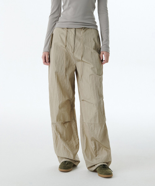 Womens Bright Nylon Parachute Pants [Light Beige] | Musinsa Global