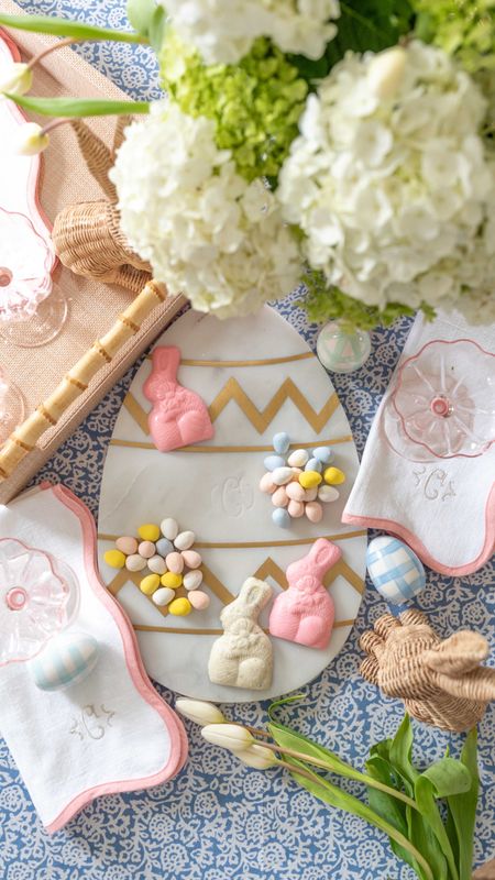 Easter table top finds: marble egg board, pink glass coupes set of 4, pink scalloped napkin sets , raffia and bamboo tray, wicker bunny set of 2, blue floral tablecloth

#LTKhome #LTKSeasonal