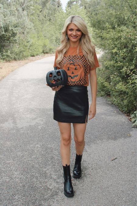 The cutest fall outfit/halloween outfit from Pink Lily! Pumpkin graphic tee and black faux leather skirt paired with skeleton earrings and black boots! Under $50!

#LTKFind #LTKunder50 #LTKSeasonal