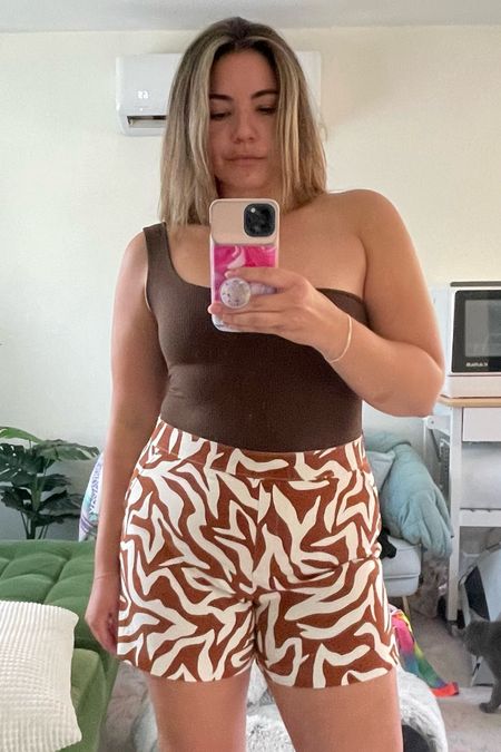 Asymmetrical ribbed shirt from Free People and animal print (zebra) shorts from Spanx for a warm weather outfit. Both fit true to size!