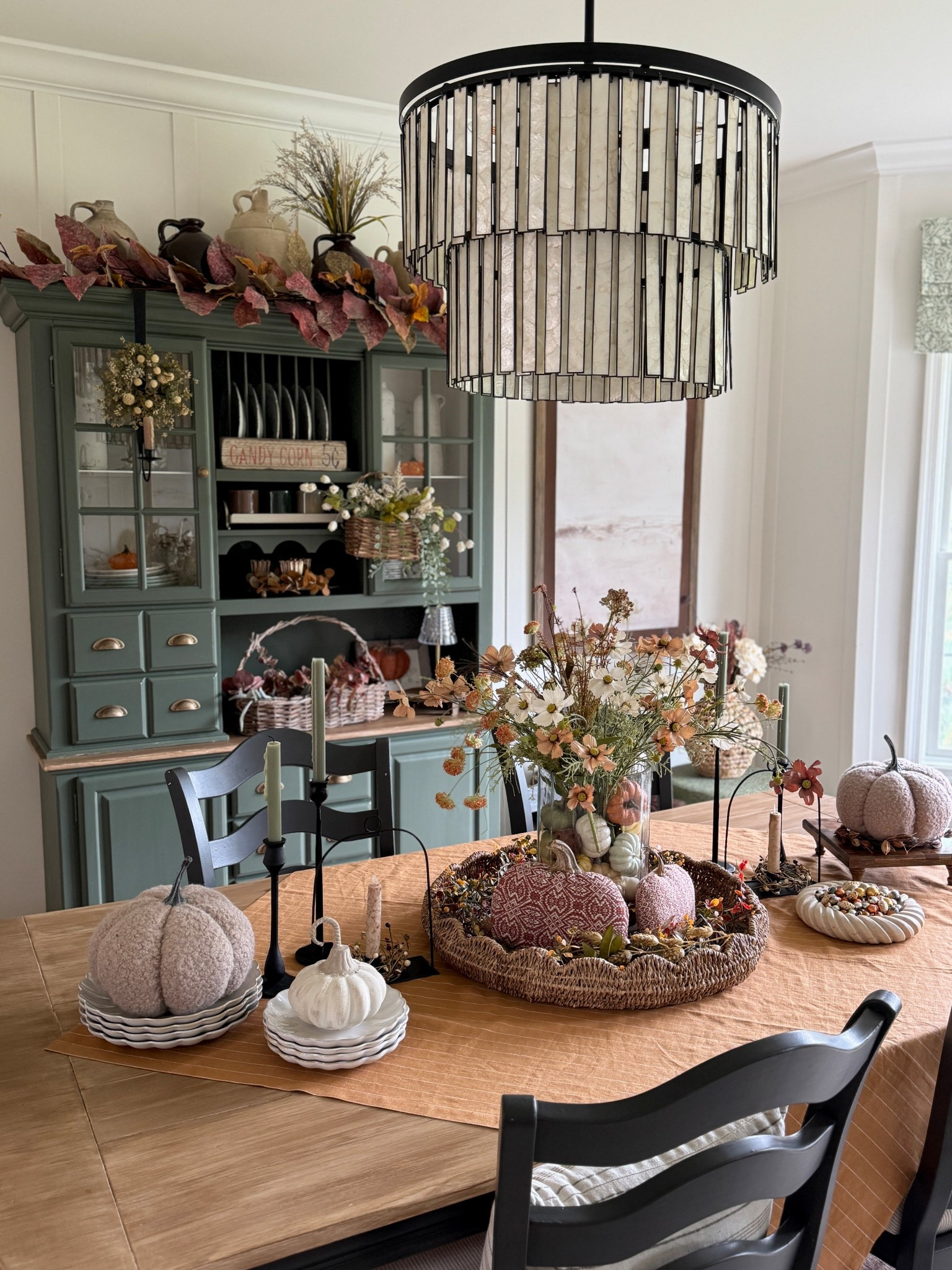 Fall decor and garland, white scalloped plates and dessert plates, Capiz chandelier, neutral wall art, wooden frame, glass candle holder used as centerpiece with gourds and florals, checkered wooden riser, Sherpa pumpkins, standing scalloped bells, antiqued glass rectangular decorative box and more  

#LTKFindsUnder50 #LTKSeasonal #LTKHome