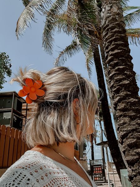 Boho beachy vacation outfit ideas. Orange flower claw clip. Crochet beach cover top. Gold hoops + gold choker necklace. Gold sunglasses chain. 

#LTKU #LTKSeasonal #LTKFind