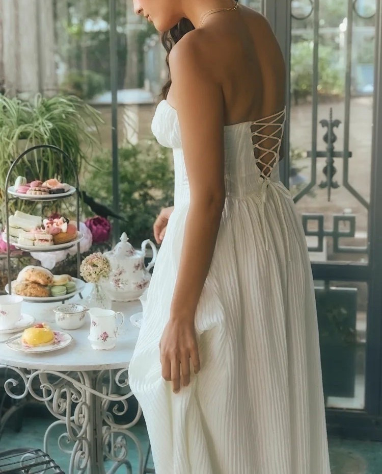 Celebrate garden parties in the romantic Aspen Ivory Plisse Strapless Bustier Midi Dress. This midi dress is under $100.

Keywords: Garden party, midi dress, strapless midi dress, spring outfits, spring dresses, summer outfits, summer dresses, spring outfits women, resort dress, resort outfit women, resort dresses, white strapless midi dress, summer vacation dress, bridal shower, bachelorette party, rehearsal dinner, engagement party, floral print dress, floral print midi dress, floral print mini dress, pleated midi dress, floral appliqué dresss

#LTKgrwm #LTKWedding #LTKSeasonal