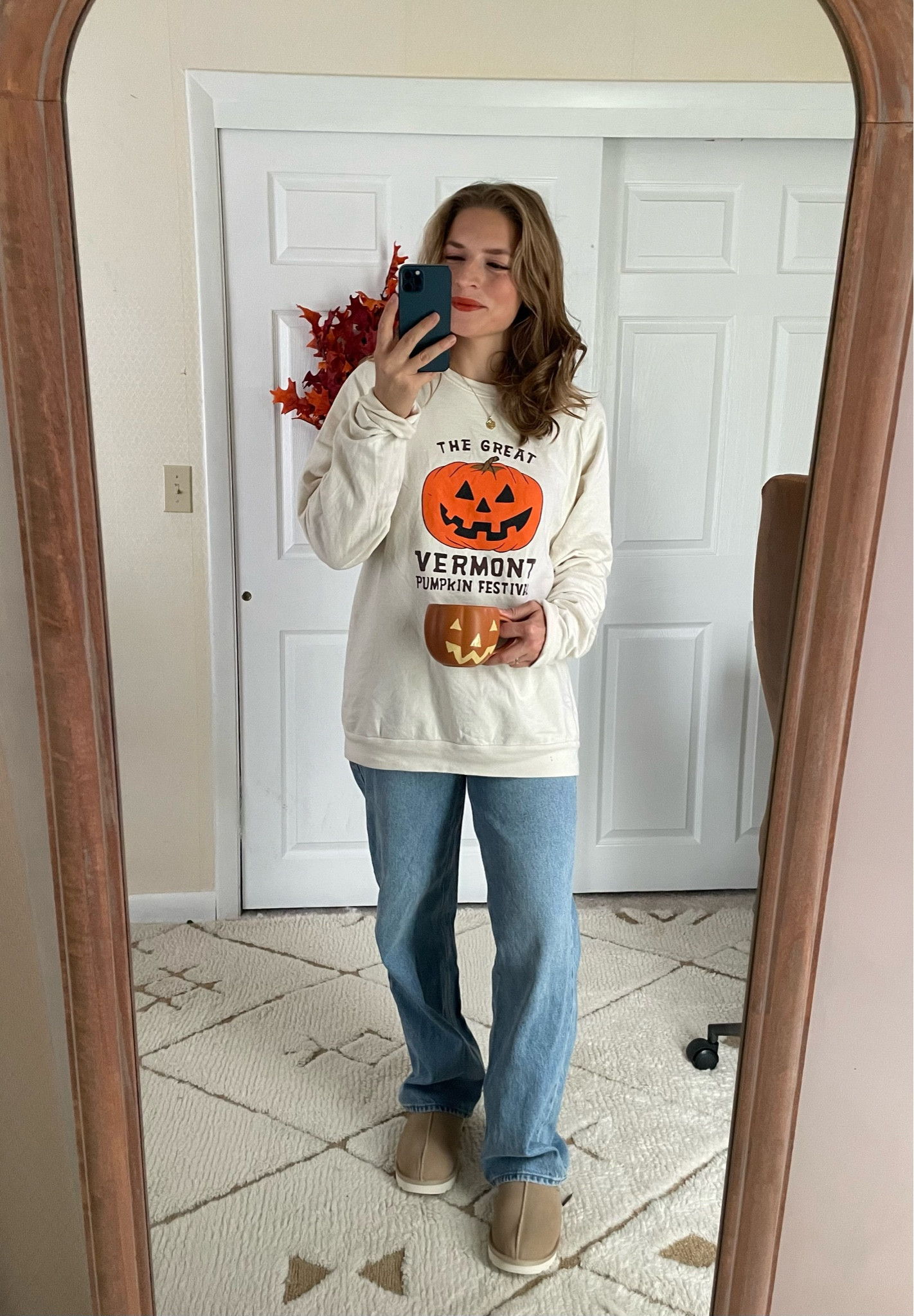 Cozy work-from-home fall outfit 🎃 Wearing a size large in the sweatshirt. Jeans run a little big; size down one 

Cozy outfit, fall fashion, wfh outfit, pumpkin sweatshirt, baggy jeans, Ugg slippers 

#LTKFindsUnder100 #LTKShoeCrush #LTKSeasonal