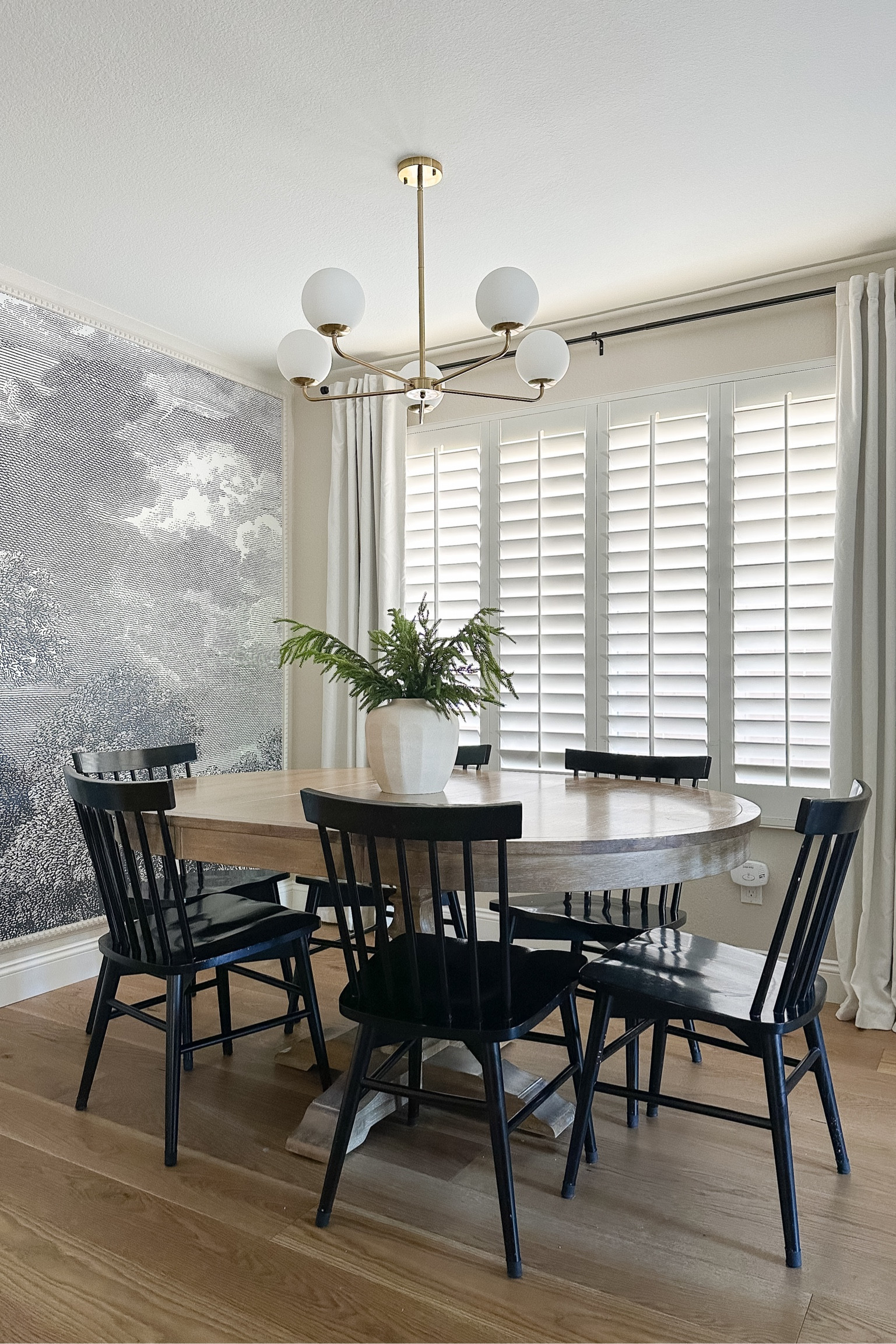 Holiday stems, Norfolk pine stems, simple holiday centerpiece, black dining chairs, neutral vase.

#LTKHoliday #LTKhome #LTKSeasonal