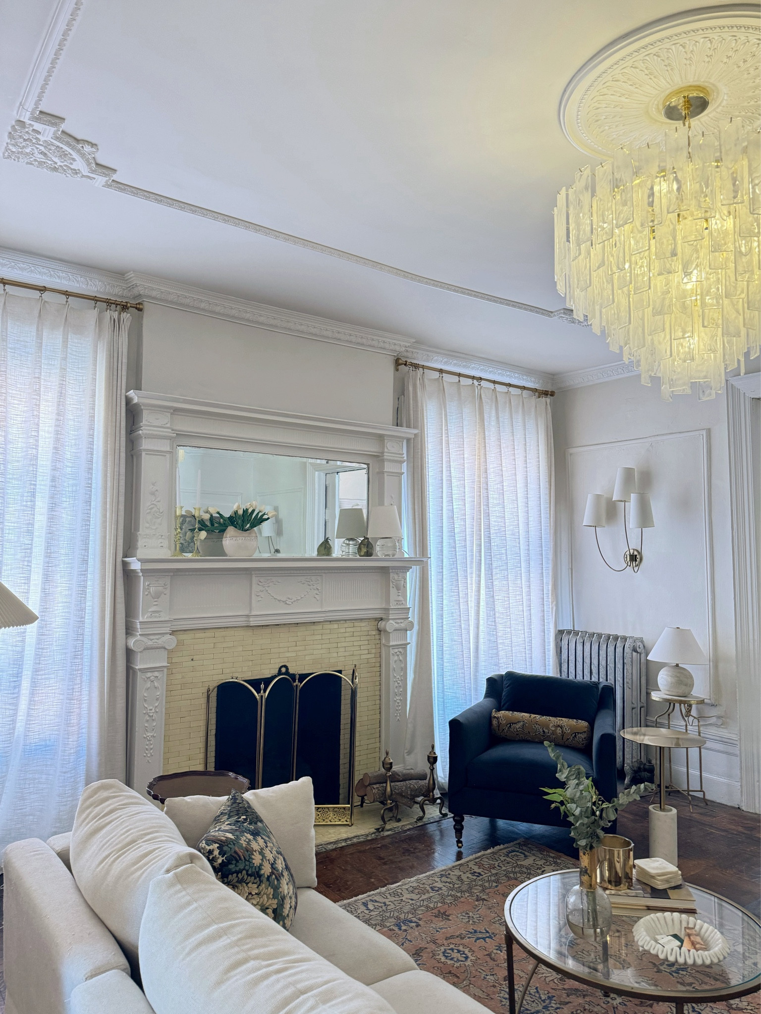 Living room updates- new chandelier, ceiling molding, linen curtains, accent chair, throw pillows, coffee table, decorative bowl, vintage rug 

#LTKstyletip #LTKhome