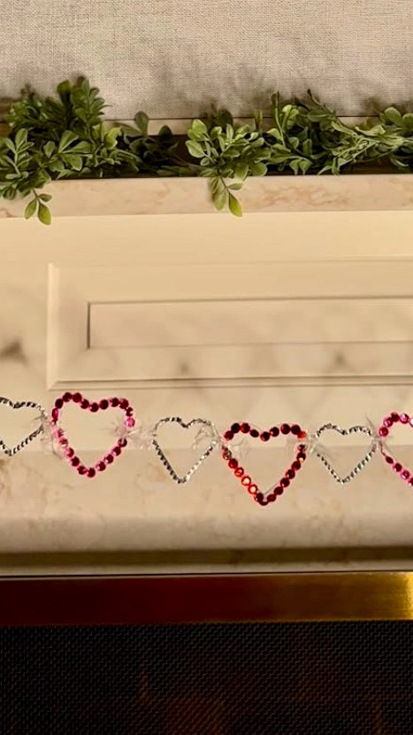 A little sparkle goes a long way ✨ This DIY heart garland is the easiest way to add a pop of Valentine charm to your mantel, shelf, or doorway. Made with simple supplies and lots of love, it’s a budget-friendly project that instantly warms up your space. Perfect for Valentine’s Day décor or sweet everyday touches all February long 💕

#ValentinesDecor #DIYHomeDecor #HeartGarland #ValentinesDIY #SeasonalDecor #MantelDecor #HomeDecorInspo #CraftyHome #LoveDecor #LTKHome