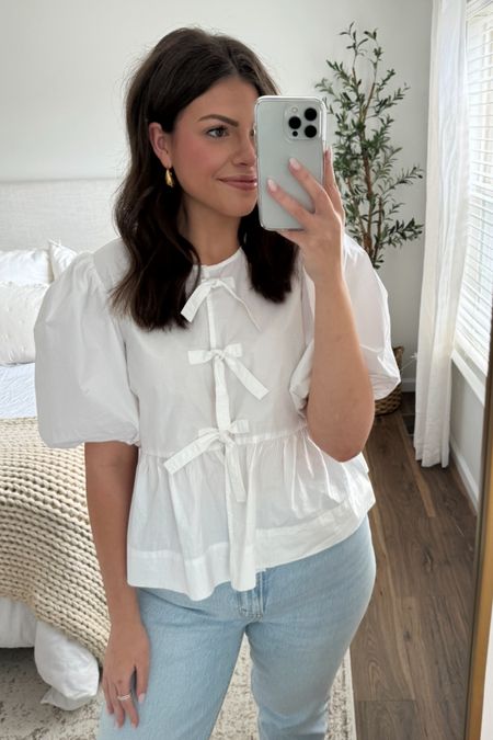 I am loving this Ganni top!!! The cute tie bows are perfection and it’s a great staple for summer!! I also linked a similar Amazon version!! 

Sizing:
Ganni Top - size 40 (size 10 - runs a little big)
Jeans - size 32 regular curve love (tts & I am 5’10)
Flats - tts#LTKmidsize #LTKstyletip

#LTKStyleTip #LTKMidsize #LTKSeasonal