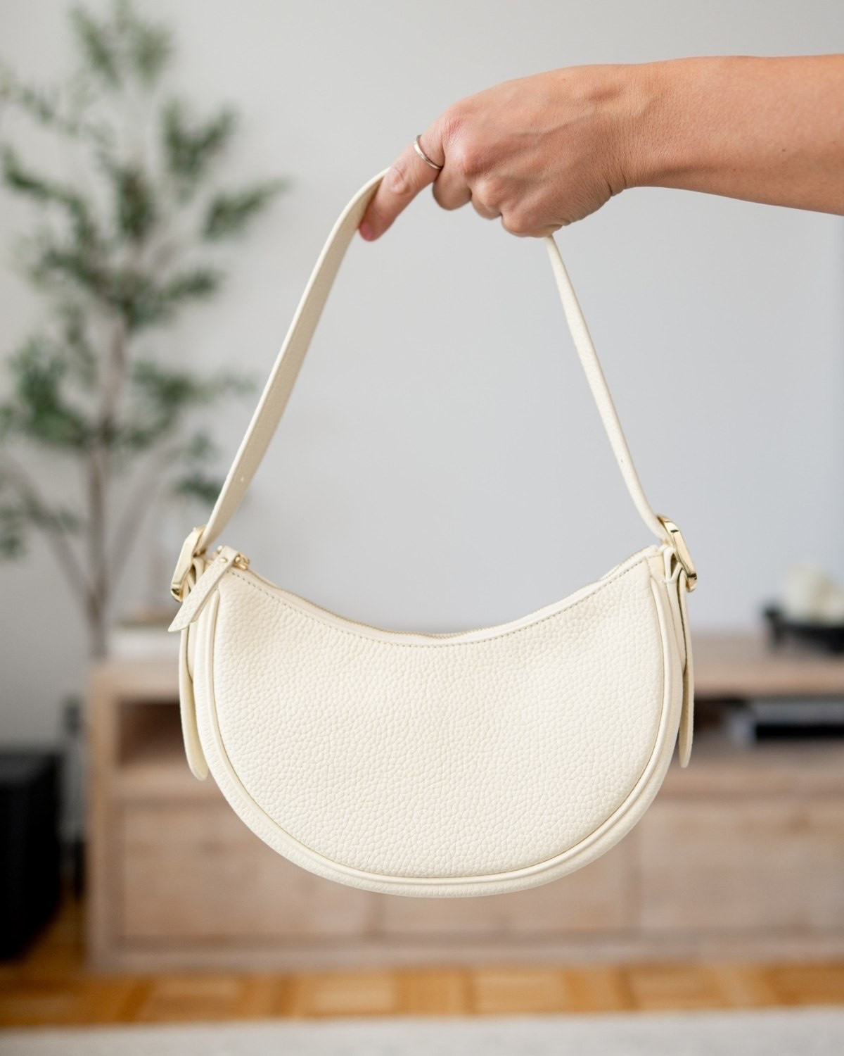 The prettiest ivory shoulder bag for an elevated everyday look. The curved shape, textured finish, and gold hardware make it feel classic while still modern.

ivory shoulder bag, cream handbag, neutral purse, everyday bag, classic handbag, chic accessories, minimalist style, elevated basics, fall handbag, shoulder bag

#LTKWedding #LTKTravel #LTKSeasonal