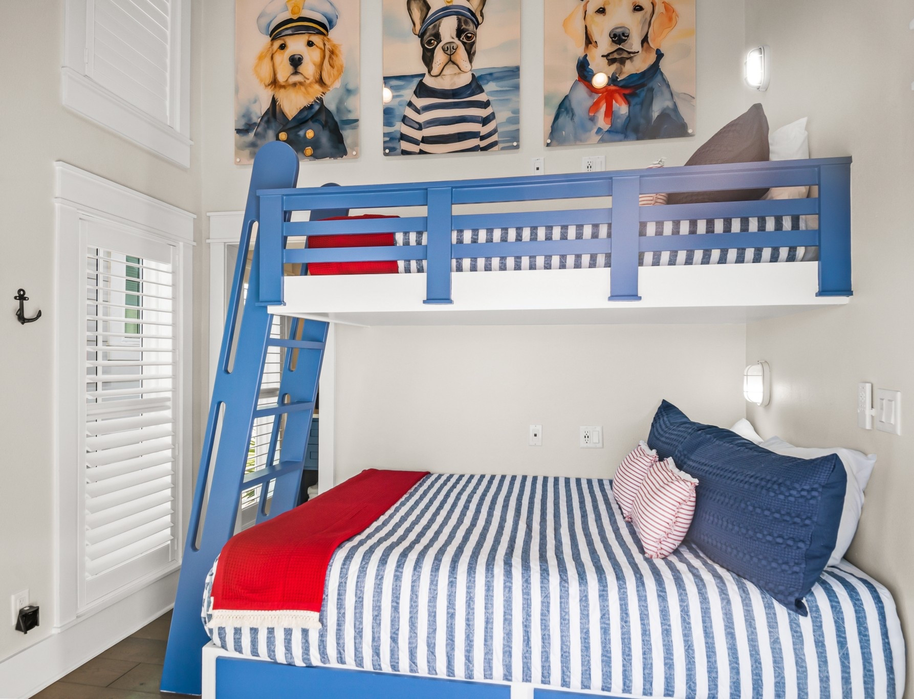 Navy stripes, whimsical sailor pups, and anchor hooks = the ultimate coastal bunk room ✨⚓ Shop the look for a playful, seaside vibe!