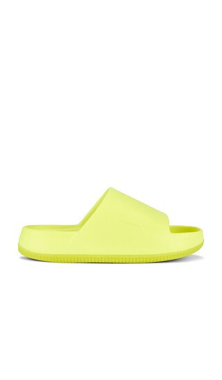 Nike Calm Slide in Yellow. - size 12 | Revolve Clothing (Global)