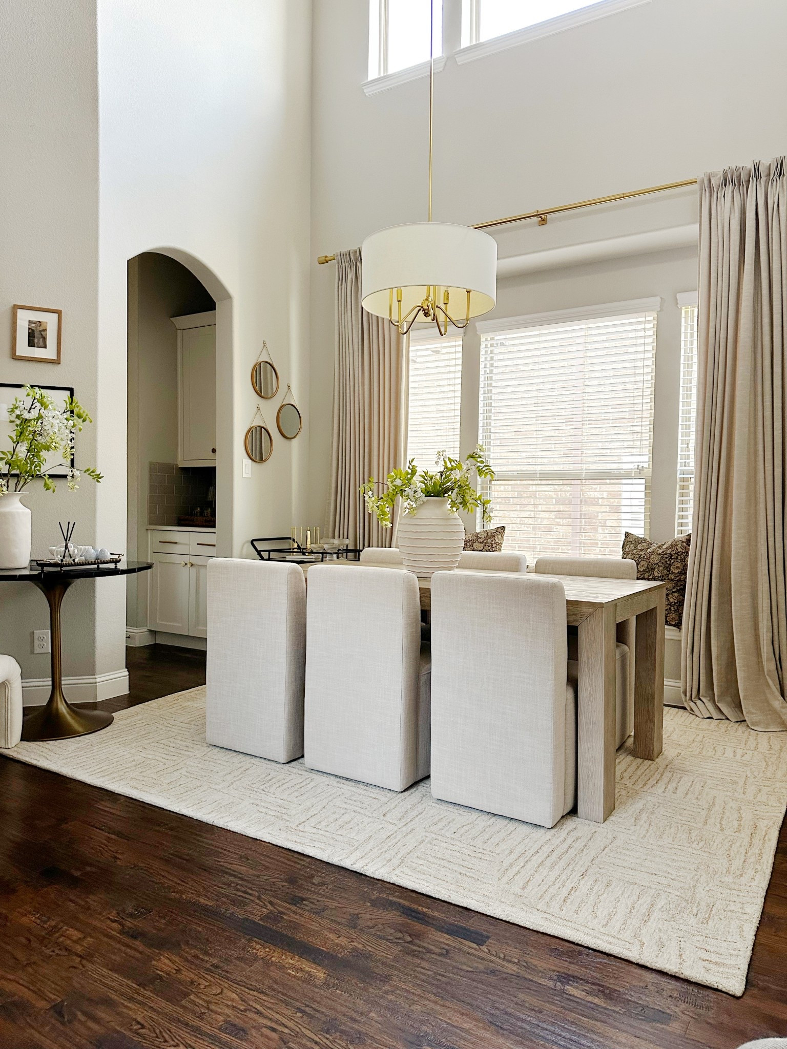 Refreshing my dining room for spring with a beautiful new rug, a lovely vase, and the prettiest faux florals!

#LTKStyleTip #LTKSeasonal #LTKHome