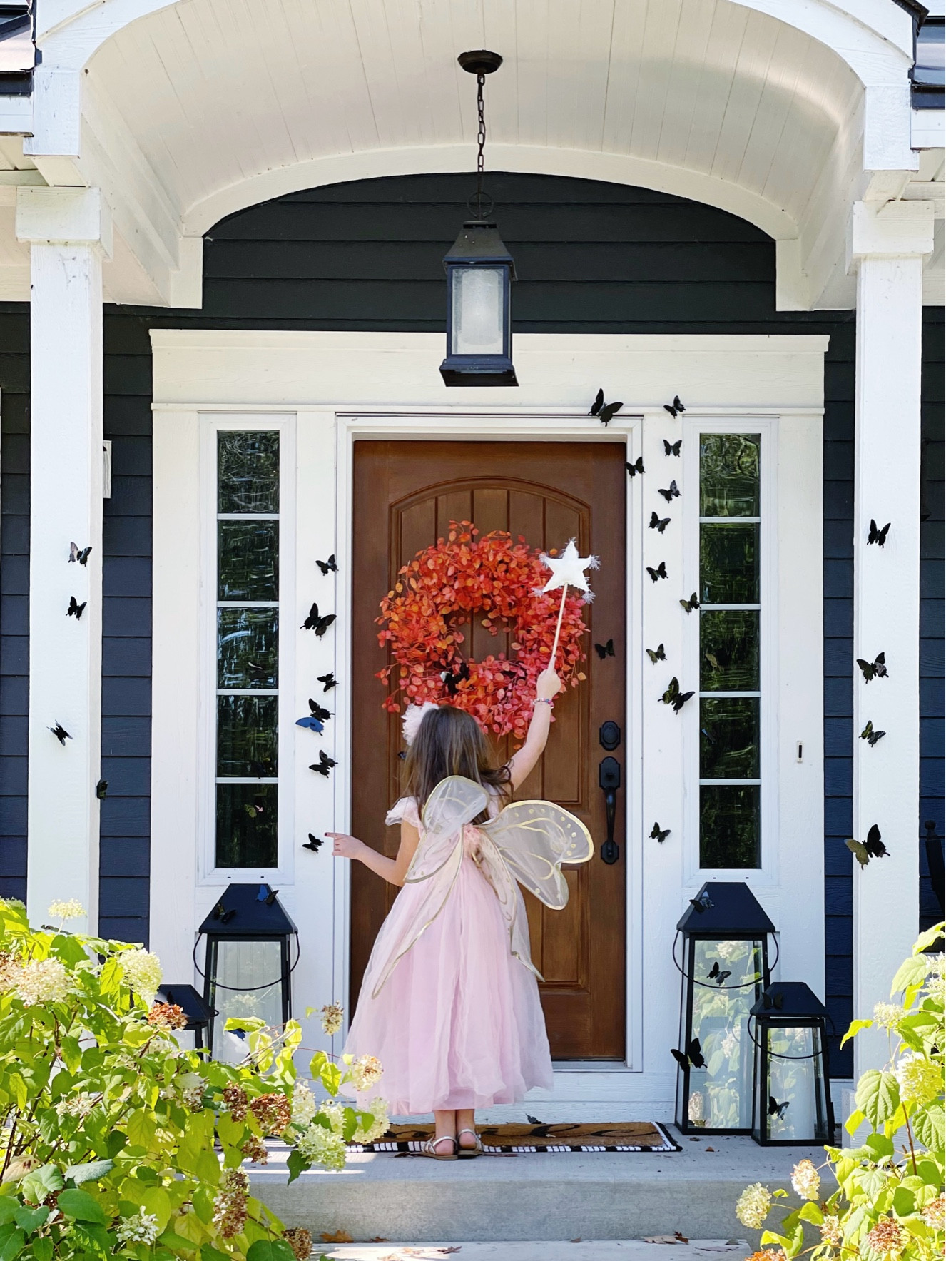 A simple and easy Halloween front porch, orange leaf wreath, butterflies, classy Halloween front porch 

#LTKHome #LTKFindsUnder50 #LTKFallSale