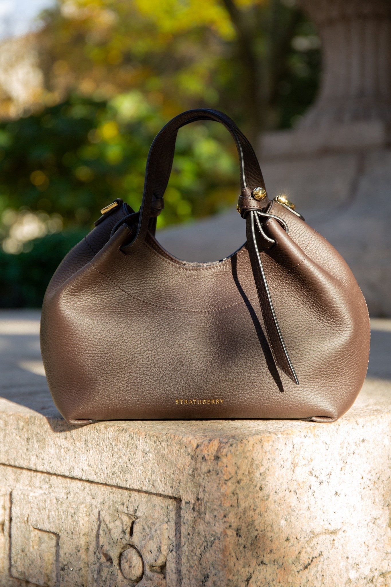 The Barra; where craft meets function. Inspired by the Scottish Isle of Barra - known for its weaving heritage and artisanal knotting - this design brings those traditions to life through sculptural, knotted details and hand-stitched finishing. The Barra Mini is compact in silhouette. Complete with a crossbody strap, it effortlessly blends statement style and everyday practicality. #strathberry



#LTKItBag #LTKHoliday #LTKSeasonal