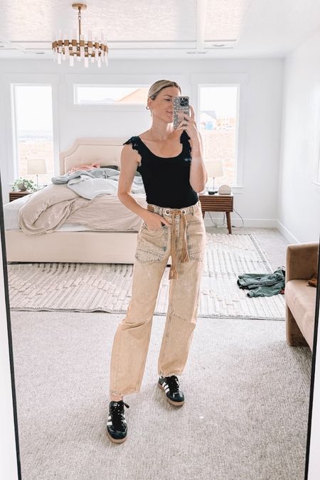 If you’ve wanted to try barrel jeans but don’t love super barrel shape, these are IT and come in lots of colors. Definitely size down though (these are a 24 and I’m usually a 25 in FP). Paired with my favorite black adidas (TTS) and the prettiest tank I own from Sezane that’s such a good staple but also makes everything a little cuter and dressier! The details are so good!

#LTKSeasonal #LTKShoeCrush #LTKStyleTip