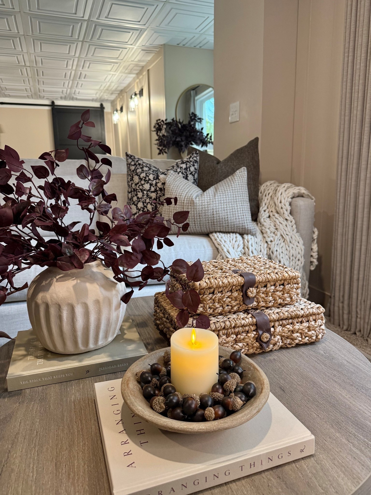 Round Coffee Table Styling Ideas 🍂

Follow @farmtotablecreations on Instagram for more cozy styling inspiration!

I love using layers and natural textures to create a warm, inviting feel. This round coffee table from Amazon, with its beautiful fluted leg design, adds a touch of character and charm to the space. I styled it with a woven basket stack, a candle nestled in acorns, and deep burgundy stems for a pop of rich autumn color. Simple pieces like these make it easy to transition your home into the fall season without overwhelming the space.

Wall Color Sand Dollar
5 Stems Used In Vase

#coffeetablestyling #falldecor #homedecor #wovenbasket #neutraldecor #amazonfinds #homestyling #livingroomdecor #roundcoffeetable #amazonprime #primeday #roundcoffeetable

#LTKHome #LTKSaleAlert #LTKSeasonal