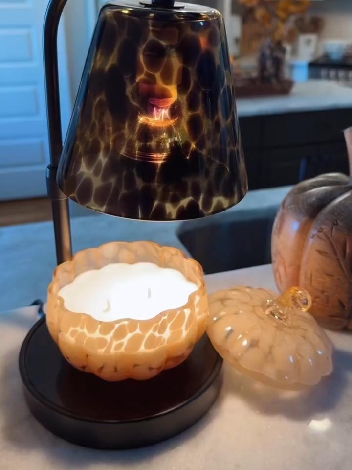 Loving this tortoise print candle warmer with this glass pumpkin candle make my house smell like fall!! They both look SO expensive but I got them from Walmart!!  

 #LTKSeasonal #LTKHome