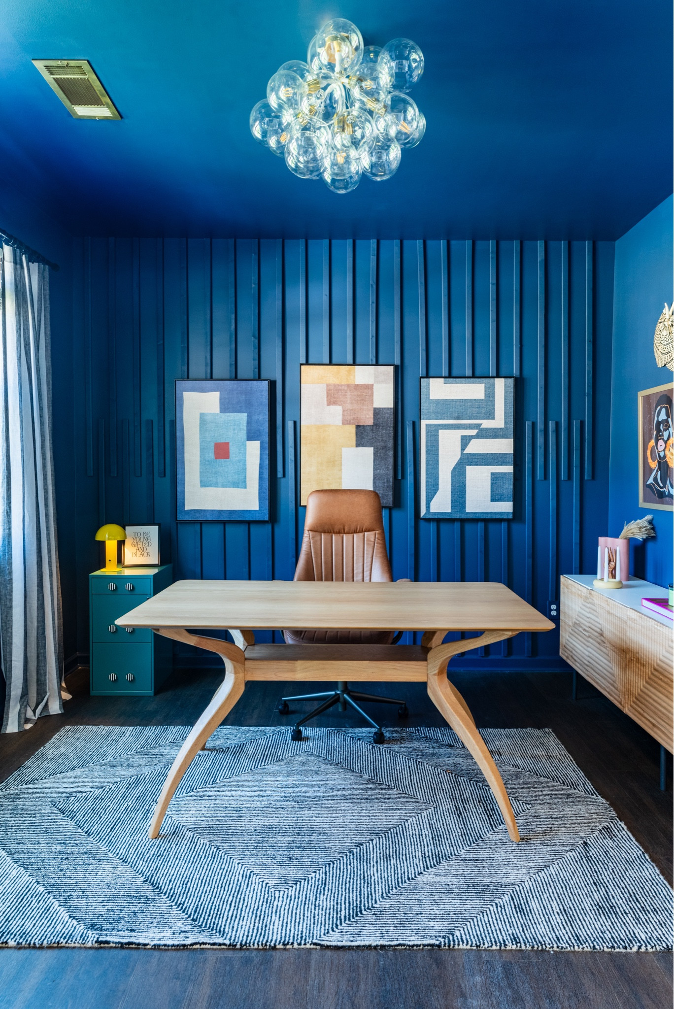 There’s nothing like working in an office that you love. I designed this office for a client. So much color and art! I love mixing colors and patterns. I love the striped curtains and the striped file cabinet knobs! 

#LTKGiftGuide #LTKstyletip #LTKhome