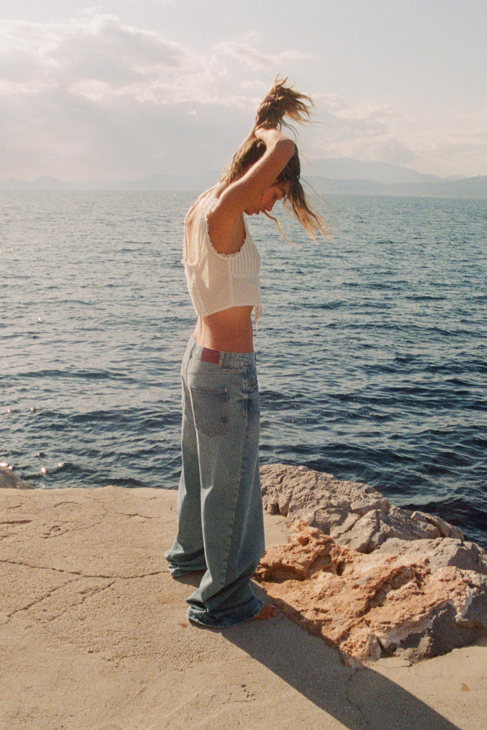 V-neck top with lace trim and wide straps. Featuring pintucks and embroidery on the front. Shirre... | Zara UK