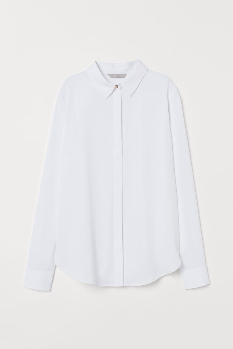 Blouse in soft woven fabric with a narrow collar, concealed buttons at front, and long sleeves wi... | H&M (US + CA)