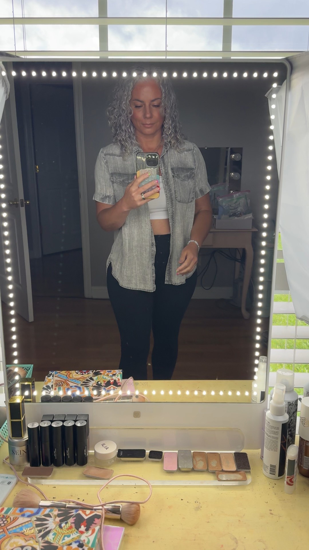 Effortless & elevated 🖤 These black buttery-soft leggings are a dream, paired with a white tube top, my go-to gray denim shirt, a comfy strapless bra (yes, it actually stays put), and layered silver necklace for a little shine ✨ Shop the full look on my LTK 💻🛒 #OOTD #LTKStyle #EverydayChic