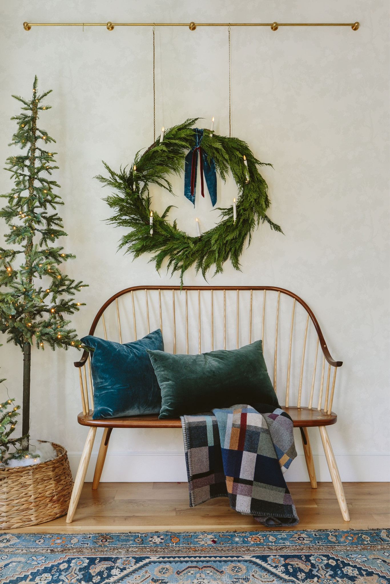 It makes me so happy every time I look over here (that window doesn’t hurt). Last year I bought these plug-in pre-lit alpine trees, and this year I partnered early on some decor from Terrain (the wreath, garland, and clip-on candles – all so good). Then I just added more ribbon/fabric in a loose drape, and put some of my velvet pillows over there. It’s so jewel-toney and yet still feels unabashedly Christmas (IMHO). I also love how the wreath hangs on the gallery rod chain (Pepe & Carols). I haven’t done the front door or outside yet, but this entry feels really good this year.

#LTKCyberWeek #LTKhome #LTKHoliday