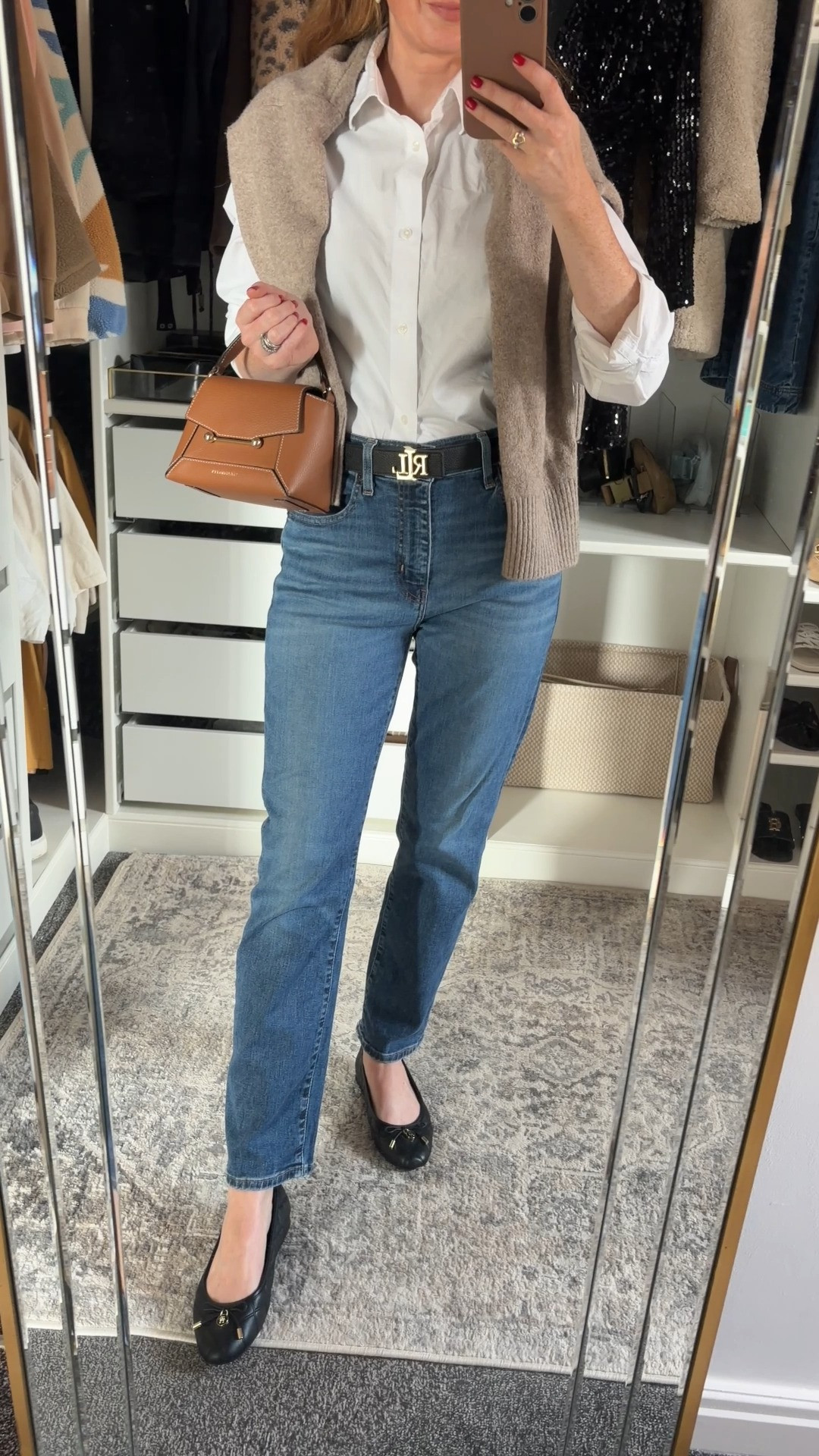 The autumn outfit formula I keep coming back to 🤎 Classic white shirt, straight leg jeans and a cosy knit draped over the shoulders, finished with ballet flats and my favourite tan bag. Perfect for coffee runs, running errands & everything in between 🍂✨ fall fashion hauls, business casual workwear 

 #LTKuk #LTKautumn #LTKjeans