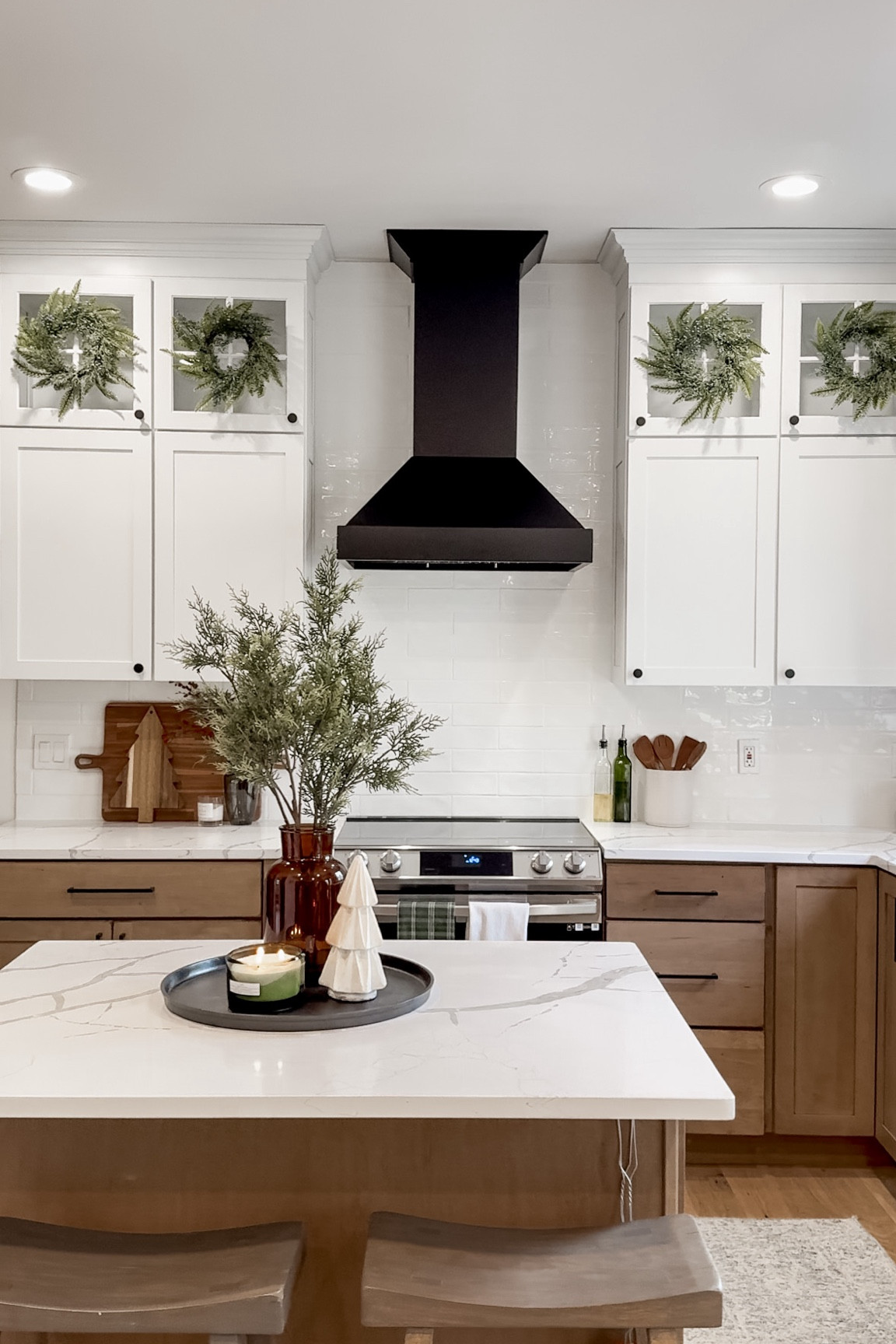KITCHEN INFO:
Cabinets: Kraftmaid (Ellery Style) from Home Depot
Uppers: Dove White
Lowers: Husk stain on Maple wood
Counters: Quartz from a local supplier
Backsplash: from Floor & Decor 
Flooring: linked
Hardware: linked (I used two different length pulls on the drawers)

Everything else is linked. Appliances too. Find a full blog post with more info + cost breakdown on www.lizpacini.com!


#LTKHoliday #LTKHome #LTKSeasonal