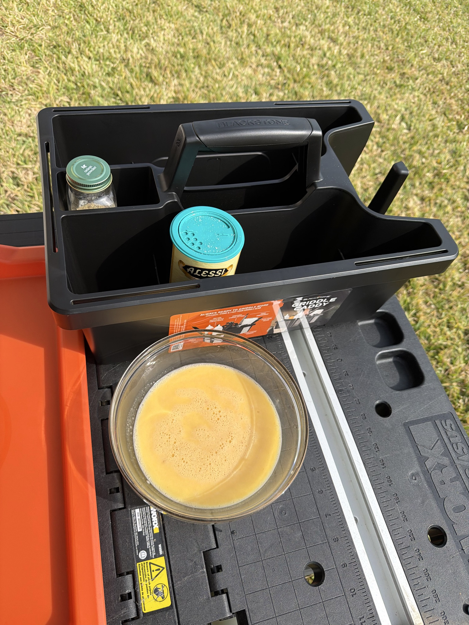 If you own a Blackstone griddle, this is one of those must-have Blackstone accessories you didn’t know you needed until you use it. 

The Blackstone GE Tool Caddy (we have the one in black) makes outdoor cooking so much easier by keeping all of your griddle tools organized, accessible, and ready to go.

This Blackstone tool organizer features 7 individual compartments for sauces, oils, seasonings, and utensils, a built-in paper towel holder on one side, plus 5 slim side holes designed to hold spatulas, griddle scrapers, tongs, and other thin Blackstone tools. 

The large central carry handle makes it easy to grab, transport, and move from prep station to grill in seconds making it perfect for quick Blackstone setup, everyday griddle cooking, backyard meals, camping, tailgating, or outdoor kitchens. 

If you’re searching for Blackstone griddle tool storage, griddle accessory organizer, or Blackstone cooking accessories, this caddy keeps everything stocked and ready so you can focus on cooking the meal, not finding your tools.

Kitchen Must Haves | Blackstone Grill | Blackstone Griddle | Blackstone Accessories | Griddle Accessories | Grill Accessories | Outdoor Cooking | Blackstone Organization | Cooking Organization | Outdoor Cooking Organization | Grill Tools | Griddle Tools | Outdoor Kitchen Essentials 

#LTKHome #LTKfoodie #LTKMens