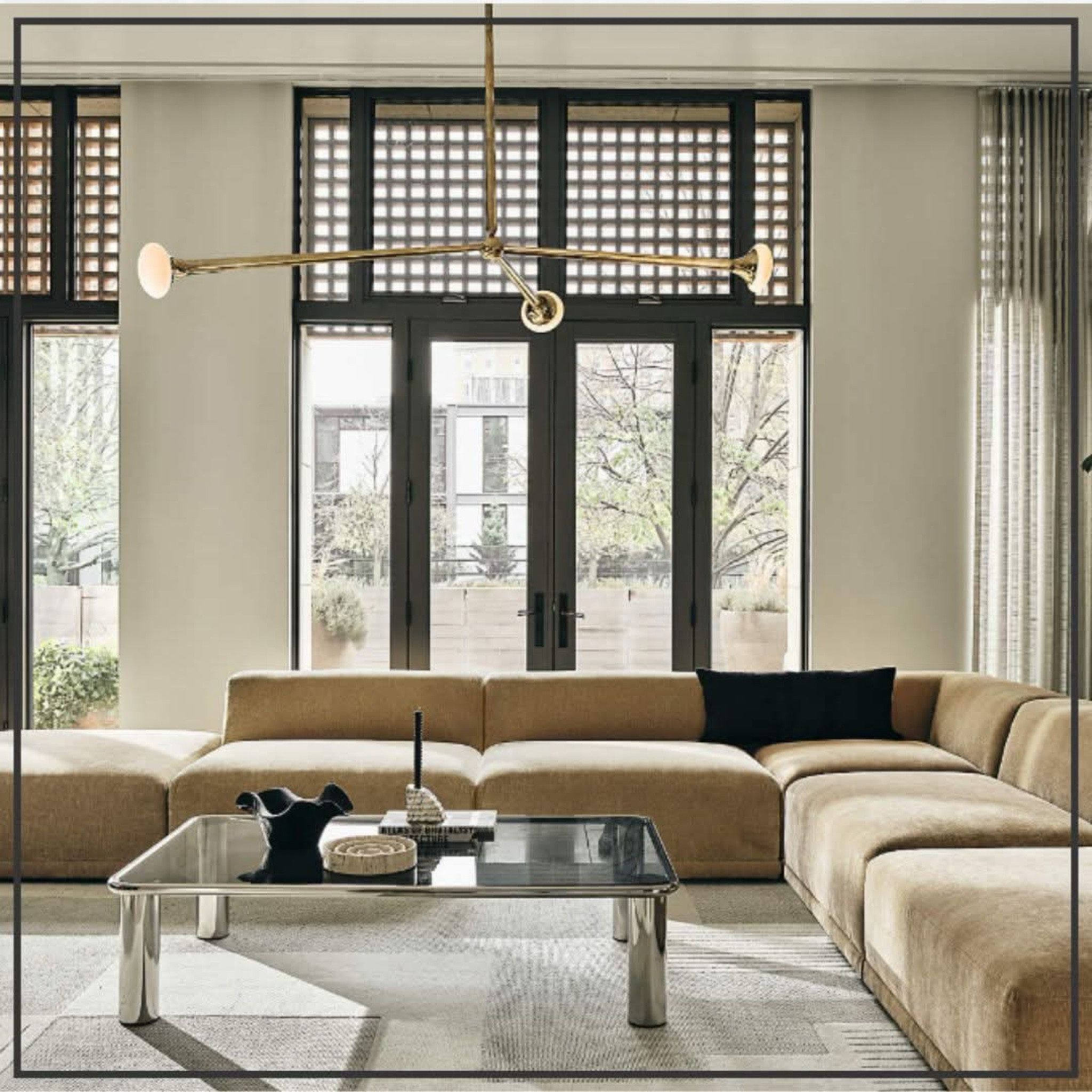 Obsessed with this modern and moody living room! The rich textures, deep tones, and that stunning gold light fixture create the perfect mix of drama and warmth. ✨ Loving the contrast of sleek metals, soft fabrics, and natural wood—such a vibe! #ModernMoody #HomeGoals #LTKHome #livingroom #sectional #goldchandelier #coffeetable

#LTKStyleTip #LTKFamily #LTKHome