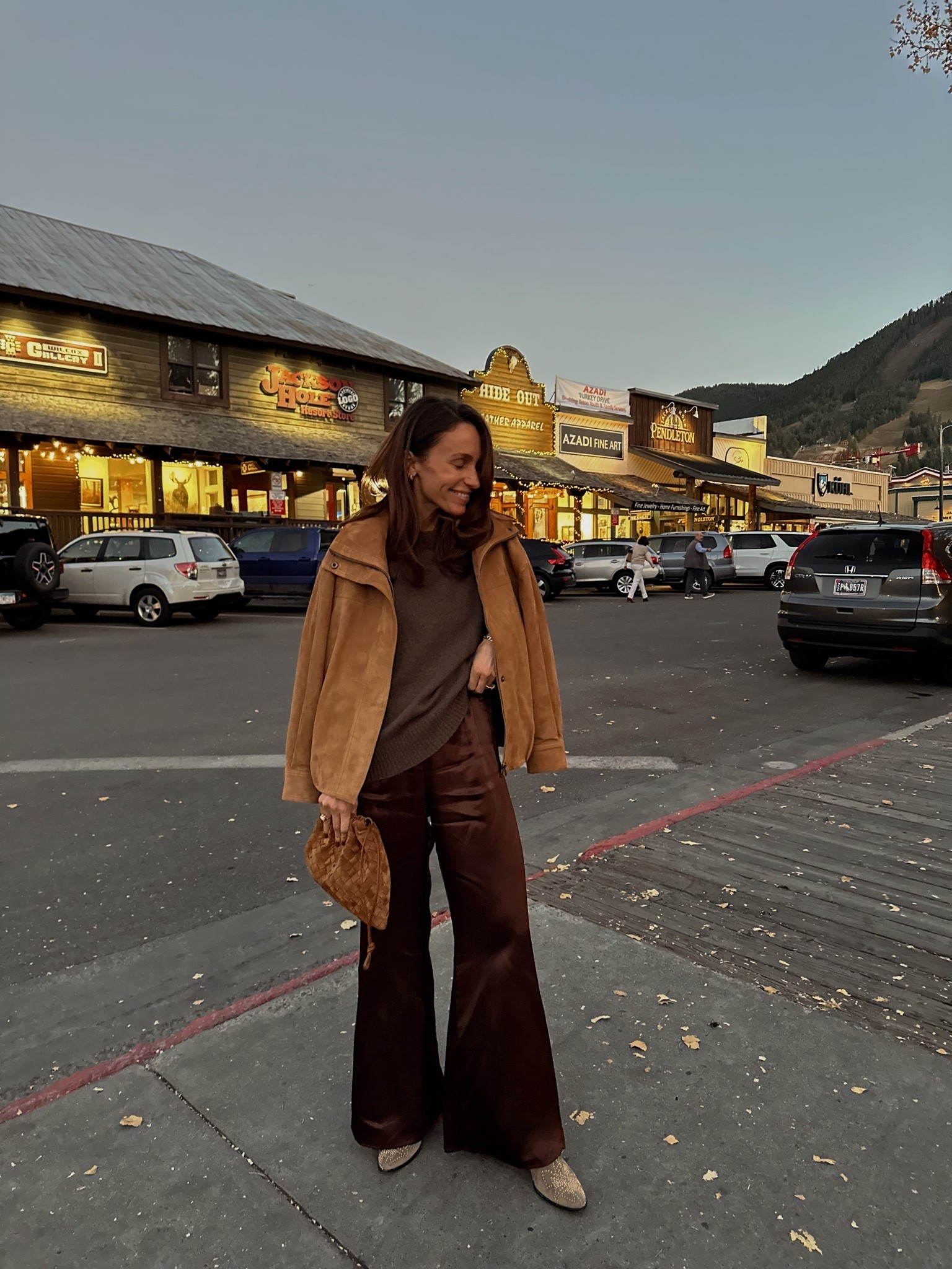 Last evening out in Jackson hole 
Wore these brown satin pants and go to relaxed brown cashmere sweater for dinner