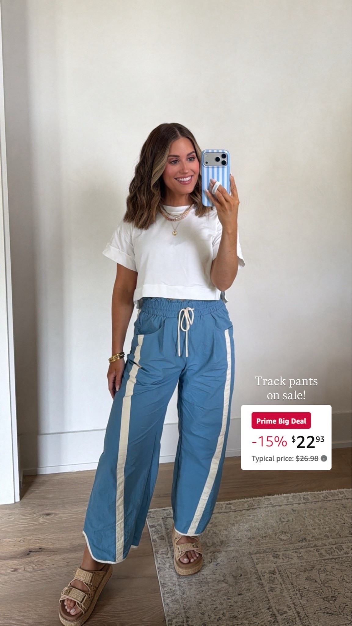 Amazon track pants on sale & under $25! Wearing a size small — comes in lots of colors! Paired with an old white tee, but will link similar.
