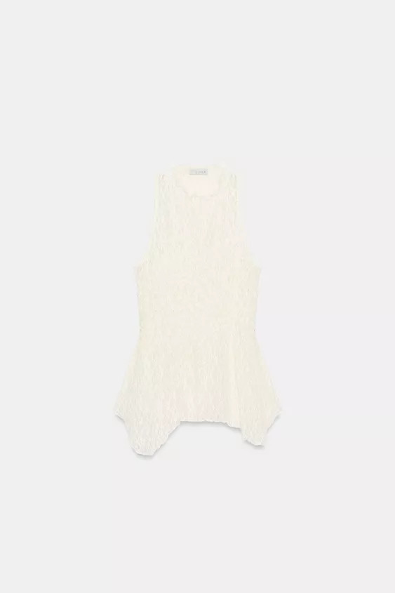 Round neck, sleeveless top. Featuring a matching lining and an asymmetric hem. | Zara UK