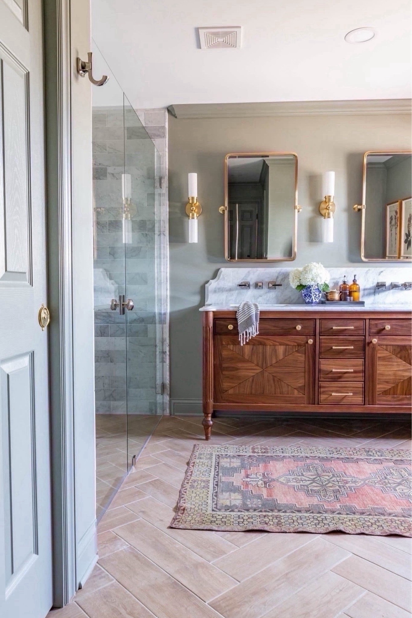 I’m so pleased with how this transformation turned out! We got rid of a giant, unused tub and traded it for a stunning double shower!! Also replaced a small vanity for this DIY double one! These changes not only improved the flow of the room and made it feel more spacious, but increased the functionality of the overall space!

Home decor ideas, simple home decor, bathroom remodel, bathroom makeover, primary bathroom inspo, master bathroom remodel

#LTKhome
