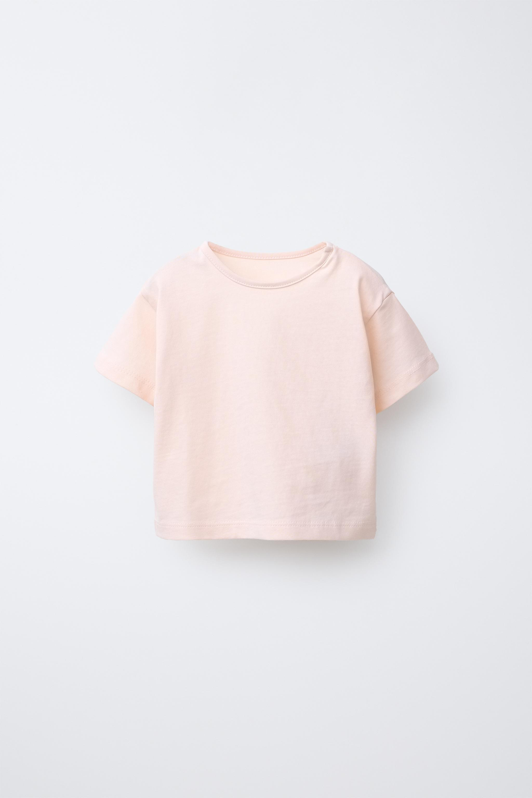 Pack of three round neck short sleeve T-shirts. Snap button closure at shoulder. | Zara US